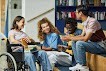 Disabled students smiling and talking